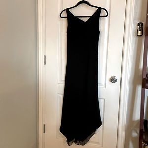 Classic black dress with asymmetrical lines